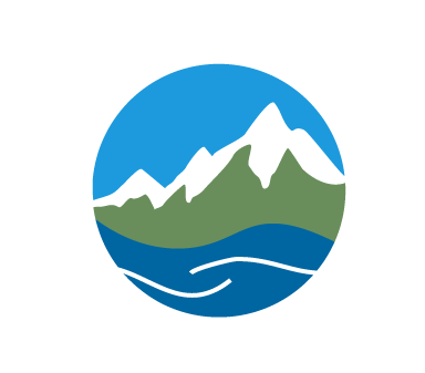 A circular icon with mountains and water.