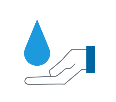 A water droplet above a hand. 